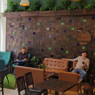 two men sitting in a coffee shop