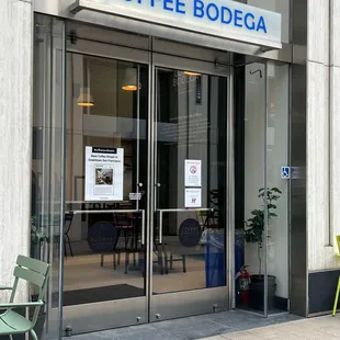 the entrance to a coffee shop