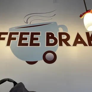 a sign for a coffee shop