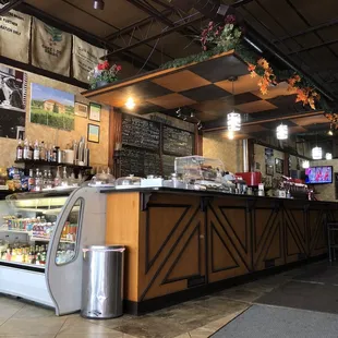 a coffee shop with a counter and a bar