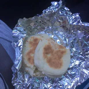 two english muffins wrapped in aluminum foil