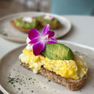 a plate of eggs and avocado