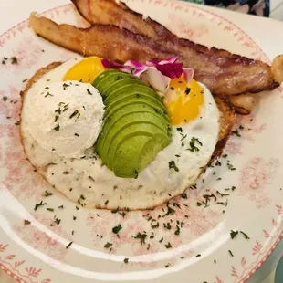 Fried eggs on Avocado Toast with bacon