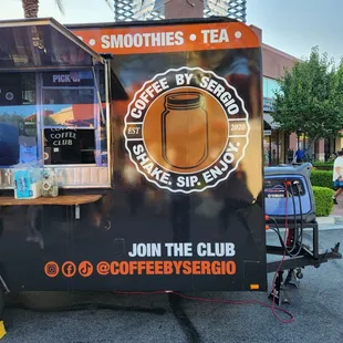 a coffee truck parked in a parking lot
