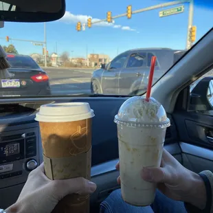 a person holding a cup of coffee