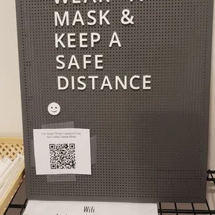 Wifi password along with a reminder at their sanitizing station