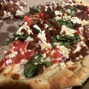 a slice of pizza on a table