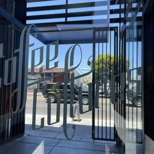 Etched sign outside Coffee Cultures in Alameda.