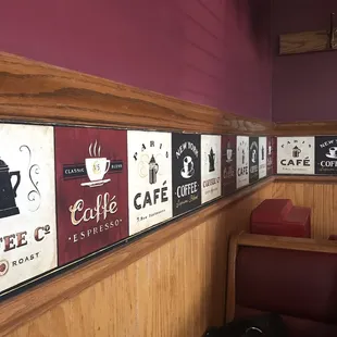 a wall of coffee signs
