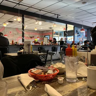 people sitting at tables in a restaurant