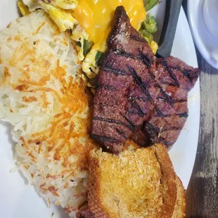 Steak and Eggs Jalapeños and cheese in eggs Wheat toast w/butter Hashbrowns