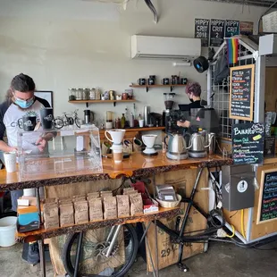 a woman working at a coffee shop