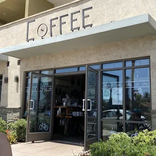 the entrance to a coffee shop