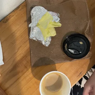 Flat White and remainder of what was once a Vegan burrito