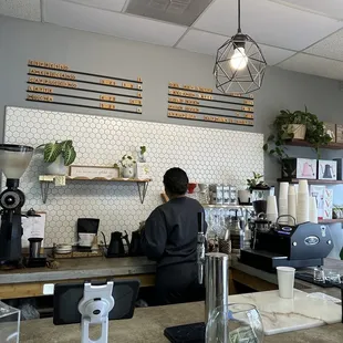 a man working in a coffee shop