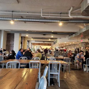people sitting at tables in a coffee shop