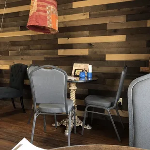 Cozy sitting area inside this shop that sells coffee and tea for here or to go as well as gifts and specialty snacks.