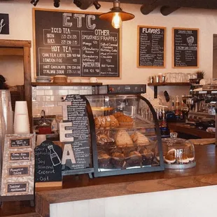a coffee shop counter and menus
