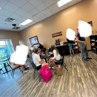 a group of people in a coffee shop