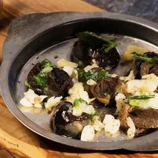 a pan of food on a cutting board