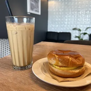 a sandwich and milkshake on a table