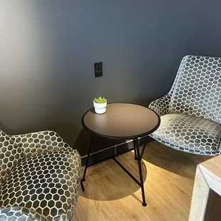 a coffee table and two chairs