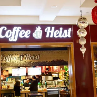 the entrance to a coffee shop