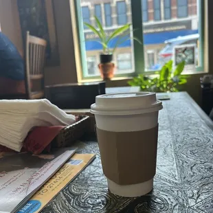 a cup of coffee on a table