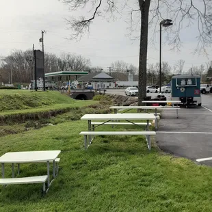 picnic tables in a parking lot