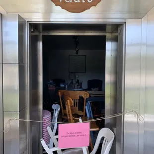 a chair and a sign