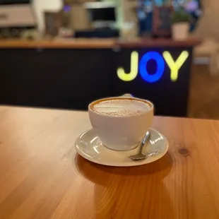 Latte with cinnamon and maple flavoring.