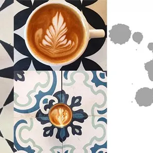 a cup of coffee and a drawing of a leaf