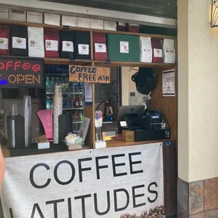 a man standing in front of a coffee shop