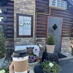 a person holding a cup of coffee