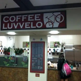 a woman standing in front of a counter