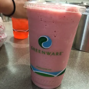 a smoothie in a plastic cup