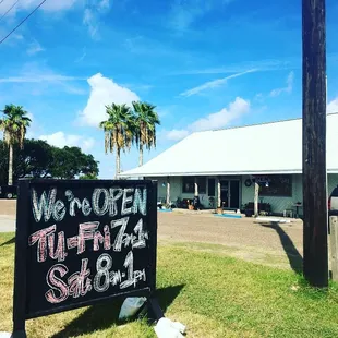  sign in front of a coffee shop
