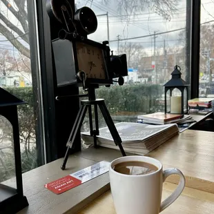 a cup of coffee and a camera