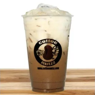 a cold beverage in a plastic cup
