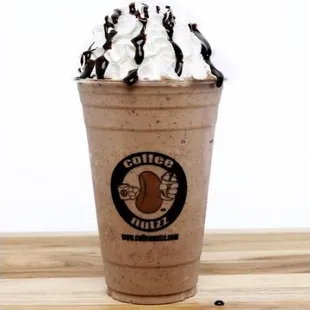 a milkshake with whipped cream and chocolate