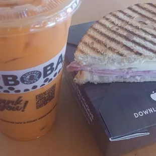 a sandwich and a drink on a table