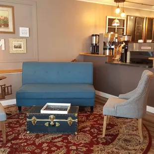a living room with a coffee bar