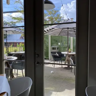 a view of a patio through a glass door