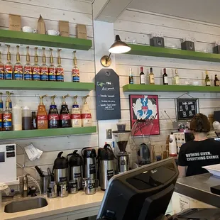 a woman at a counter in a coffee shop