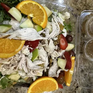 Summer fruit salad with grilled chicken and poppyseed dressing