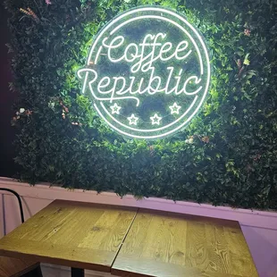 a table and a neon sign