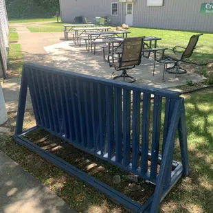 Bike rack and larger patio seating.