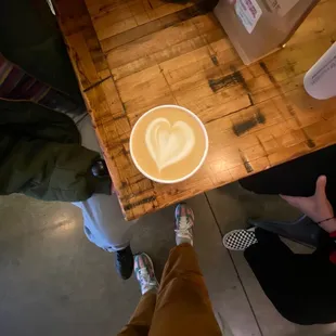 a cup of coffee with a heart drawn in it