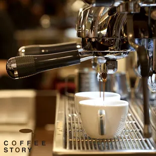 coffee being poured into a cup