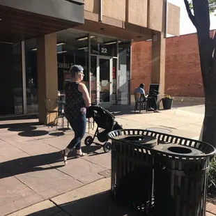 a woman pushing a stroller